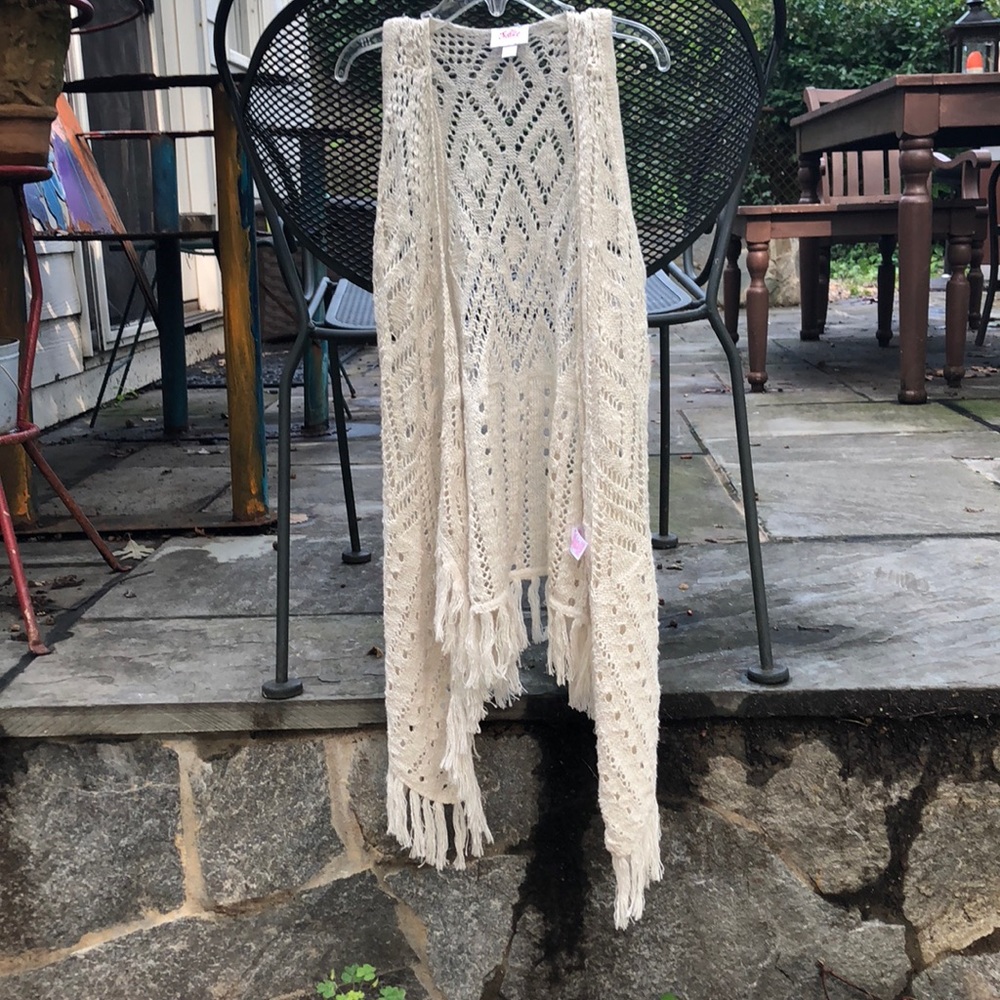 A Justice long,no sleeve, fringe sweater for kids!